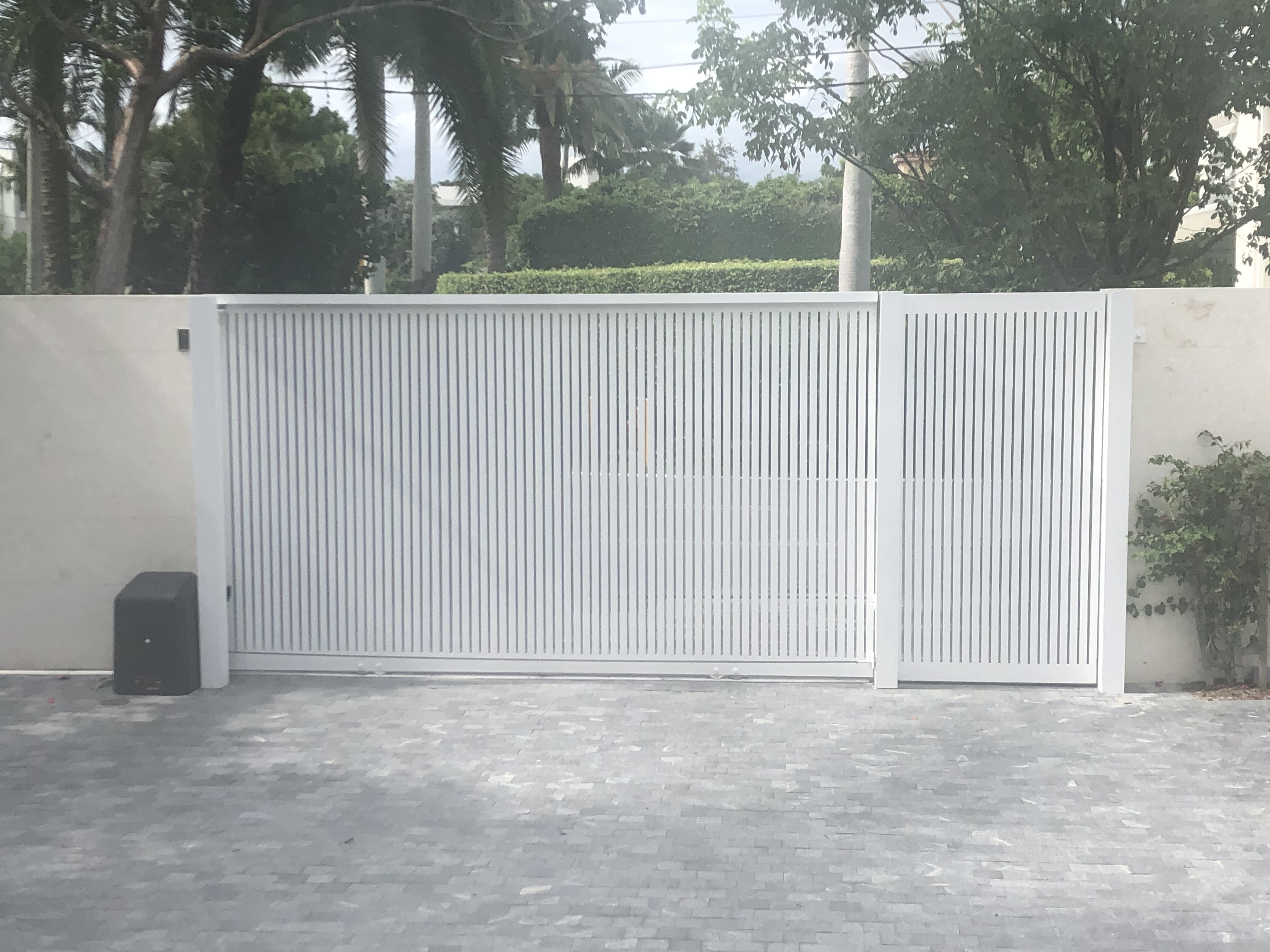 White Vertical Slat Motorized Sliding Gate