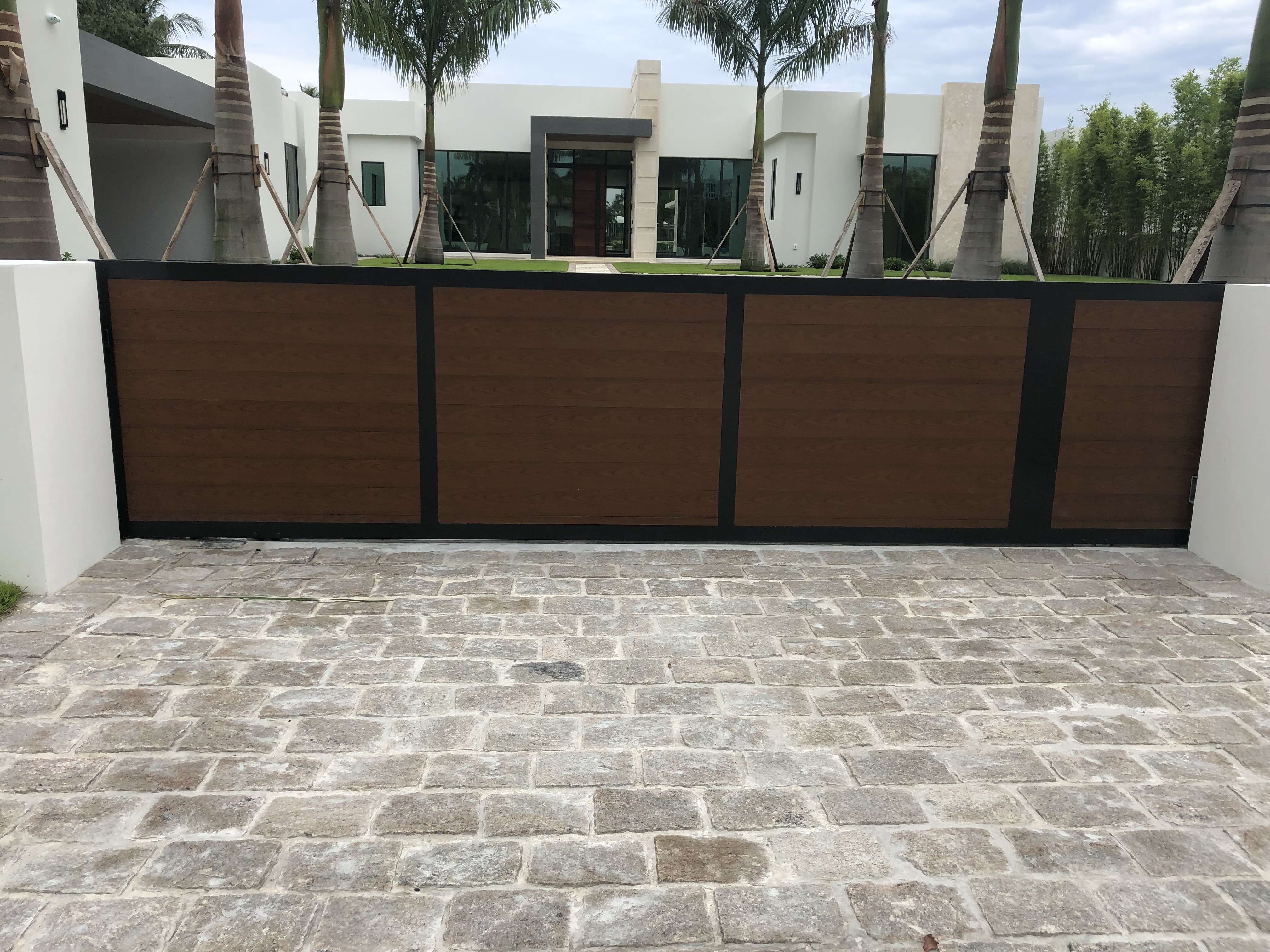 Wood-Tone Panel Sliding Gate at Luxury Estate