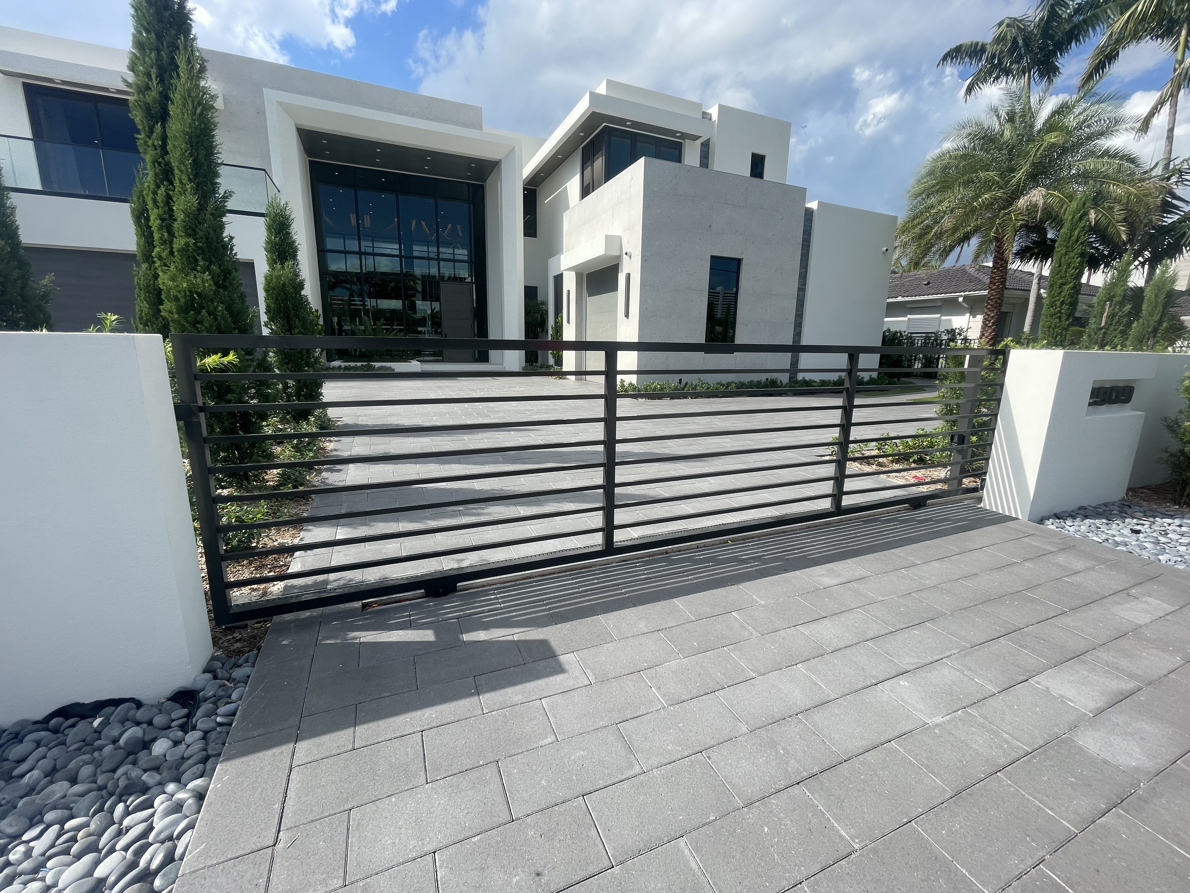 Horizontal Bar Sliding Gate at Contemporary Home