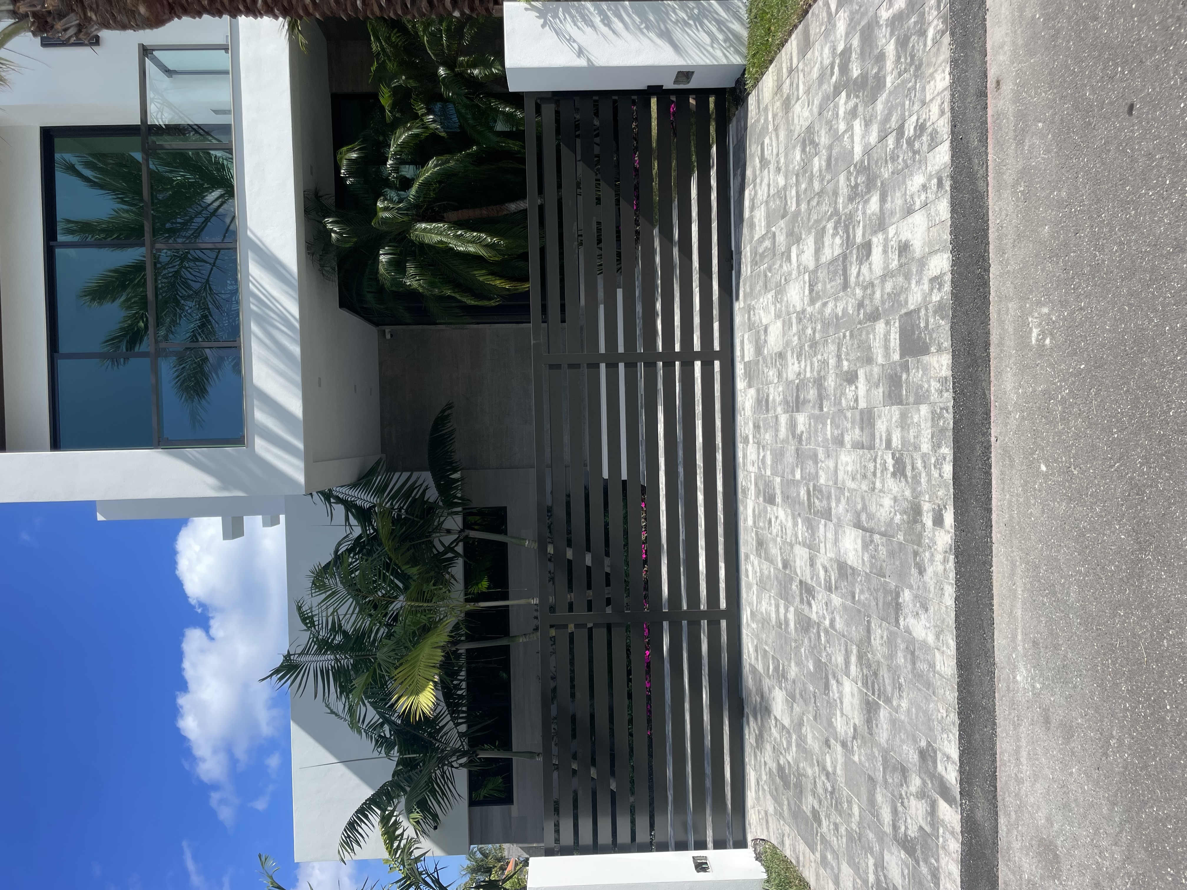 Vertical Slat Gate at Modern Tropical Residence