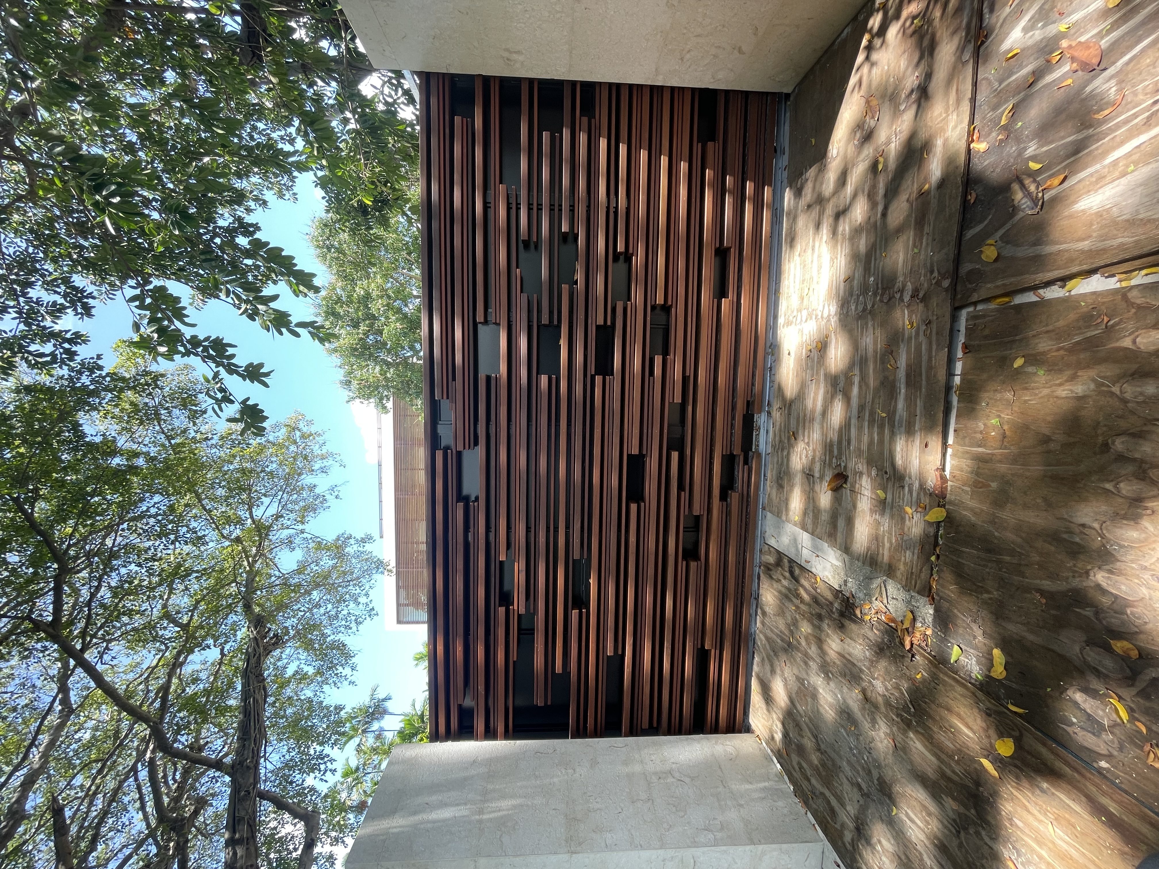 Artistic Wood-Tone Vertical Privacy Screen