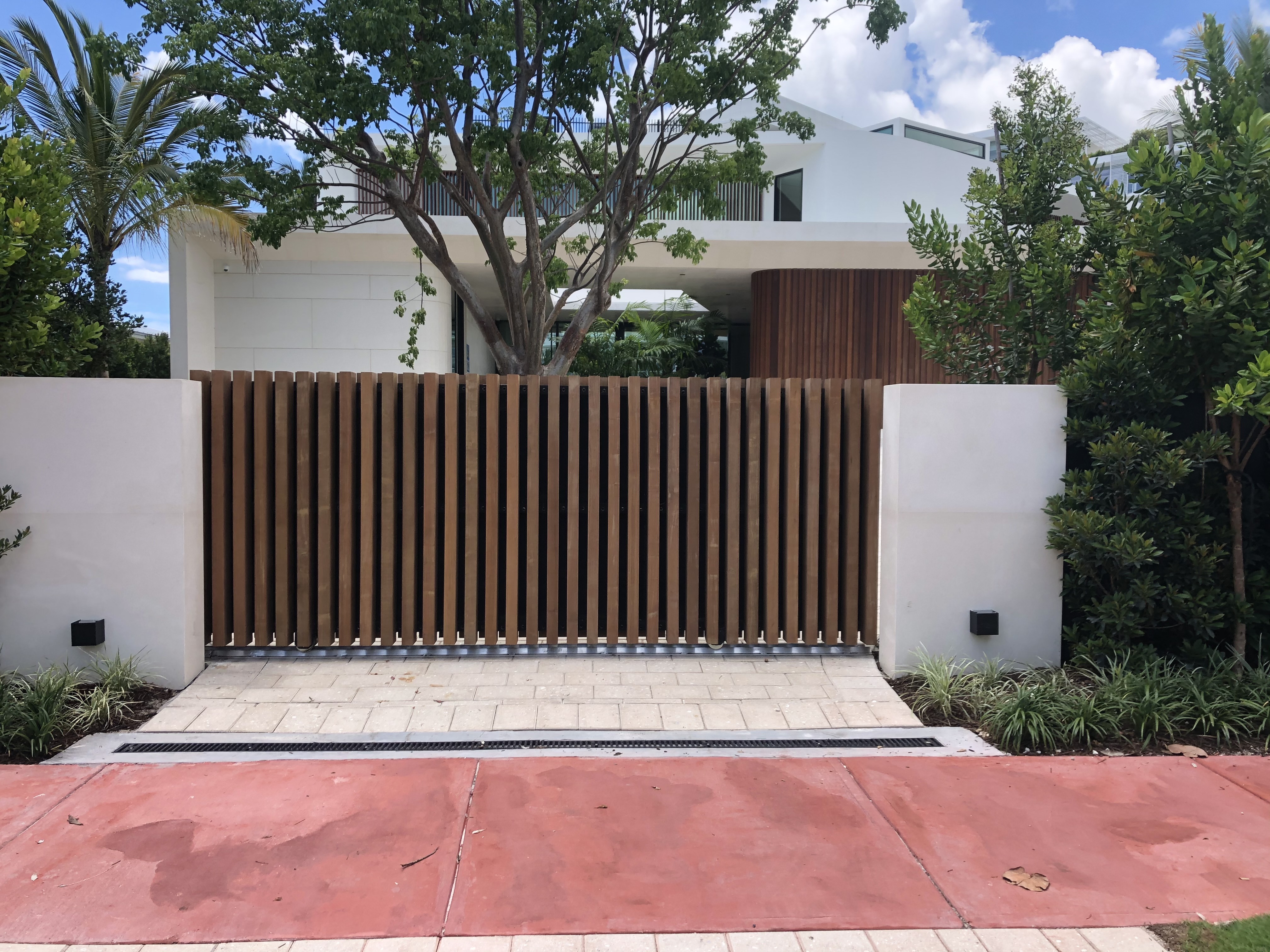 Wood-Tone Vertical Picket Sliding Driveway Gate